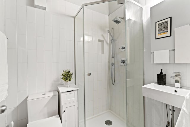 1725 W N Ave Unit 404, Chicago, IL 60622 - bathroom featuring a shower stall and tile walls