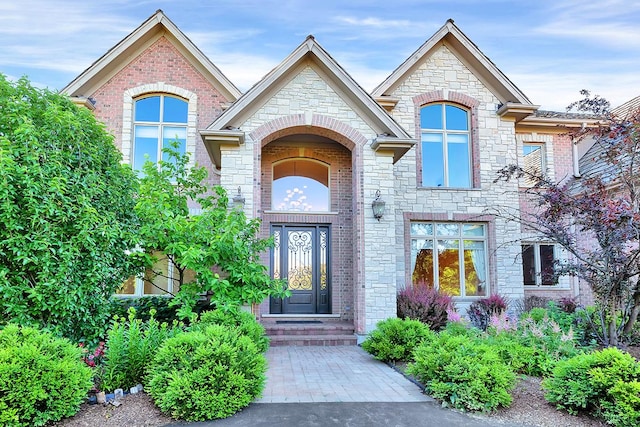 1410 W Newcastle Ct, Inverness, IL 60010 - view of exterior entry featuring stone siding and brick siding