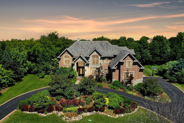1410 W Newcastle Ct, Inverness, IL 60010 - view of front facade featuring stone siding and asphalt driveway
