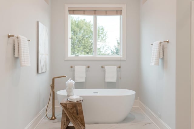 1410 W Newcastle Ct, Inverness, IL 60010 - bathroom featuring marble finish flooring, baseboards, and a freestanding tub