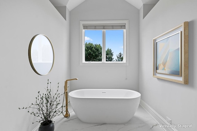 1410 W Newcastle Ct, Inverness, IL 60010 - bathroom with marble look tiles, a freestanding bath, baseboards, and vaulted ceiling