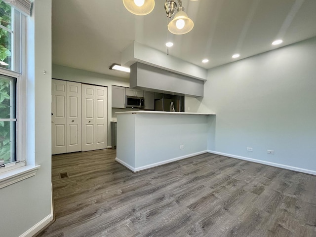 103 Hemstead St Unit 34-D, Lake Bluff, IL 60044 - kitchen with stainless steel microwave, refrigerator, dark wood-type flooring, baseboards, and recessed lighting