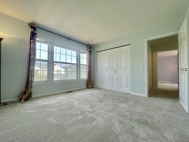 103 Hemstead St Unit 34-D, Lake Bluff, IL 60044 - unfurnished bedroom with carpet floors, baseboards, and a closet