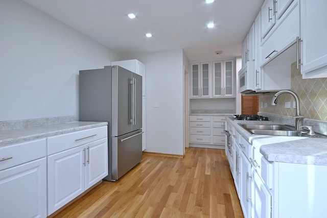 18 Winthrop Ct, Downers Grove, IL 60516 - kitchen with high end refrigerator, a sink, white microwave, white cabinetry, and light wood-style floors