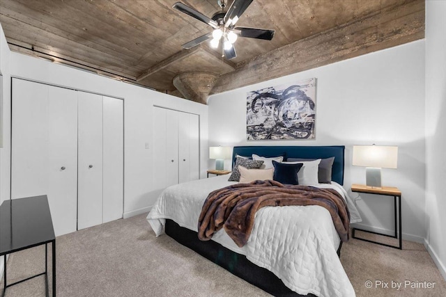 1001 W 15th St Unit 243, Chicago, IL 60608 - bedroom featuring multiple closets, carpet flooring, baseboards, and ceiling fan