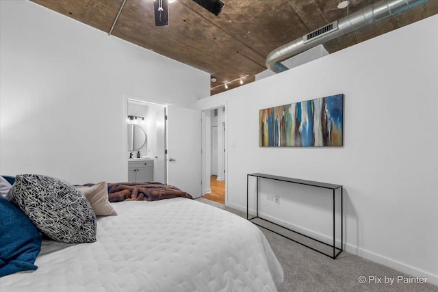 1001 W 15th St Unit 243, Chicago, IL 60608 - bedroom with carpet flooring, baseboards, ensuite bathroom, and ceiling fan