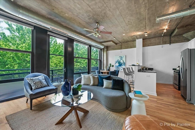 1001 W 15th St Unit 243, Chicago, IL 60608 - living room with light wood-style floors and ceiling fan