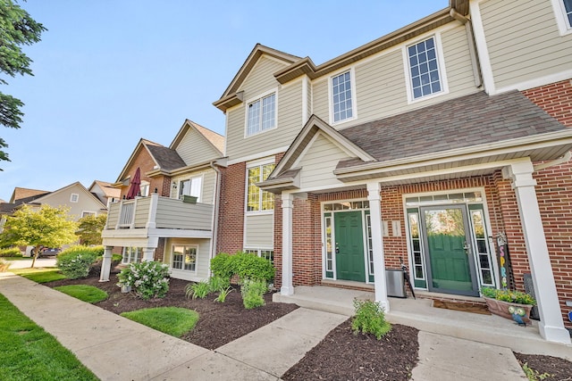 15810 Scotsglen Rd, Orland Park, IL 60462 - view of exterior entry featuring brick siding and covered porch