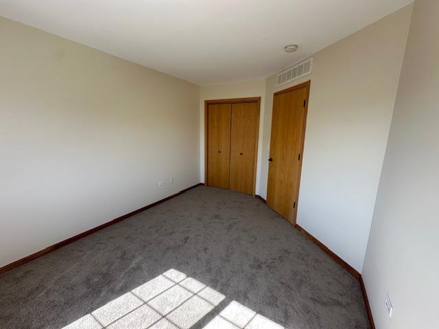 15810 Scotsglen Rd, Orland Park, IL 60462 - carpeted spare room featuring baseboards and a smoke detector