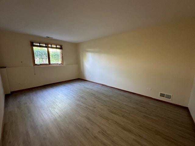 15810 Scotsglen Rd, Orland Park, IL 60462 - spare room featuring dark wood-type flooring and baseboards