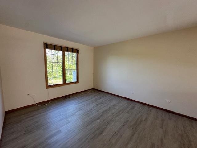 15810 Scotsglen Rd, Orland Park, IL 60462 - unfurnished room featuring dark wood-style floors and baseboards
