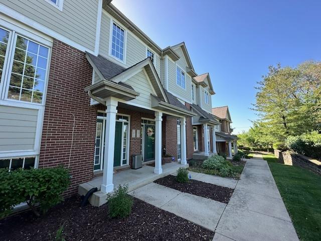 15810 Scotsglen Rd, Orland Park, IL 60462 - view of property exterior featuring brick siding and covered porch