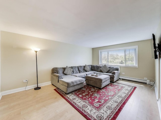 6660 S Brainard Ave Unit 103, Countryside, IL 60525 - living room featuring light wood finished floors, a baseboard heating unit, and baseboards