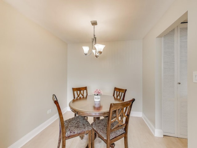 6660 S Brainard Ave Unit 103, Countryside, IL 60525 - dining room featuring a chandelier and baseboards