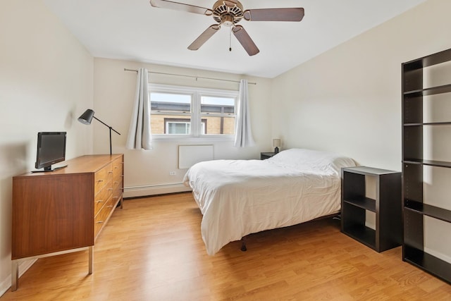 905 Graceland Ave Unit 12, Des Plaines, IL 60016 - bedroom featuring light wood-type flooring, a baseboard heating unit, baseboards, and ceiling fan
