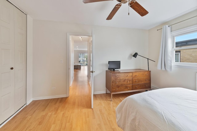 905 Graceland Ave Unit 12, Des Plaines, IL 60016 - bedroom featuring multiple windows, light wood finished floors, baseboards, and a ceiling fan