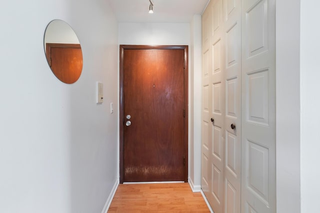 905 Graceland Ave Unit 12, Des Plaines, IL 60016 - doorway to outside with light wood-type flooring and baseboards