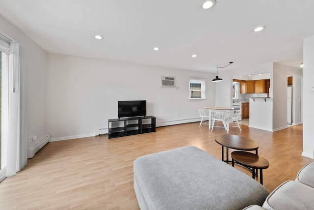 905 Graceland Ave Unit 12, Des Plaines, IL 60016 - living room with a baseboard heating unit, recessed lighting, light wood-style flooring, a wall mounted AC, and baseboards