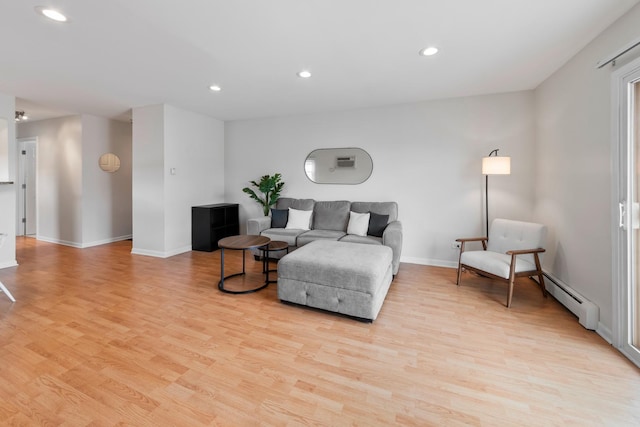 905 Graceland Ave Unit 12, Des Plaines, IL 60016 - living room featuring a baseboard radiator, light wood-style floors, recessed lighting, and baseboards