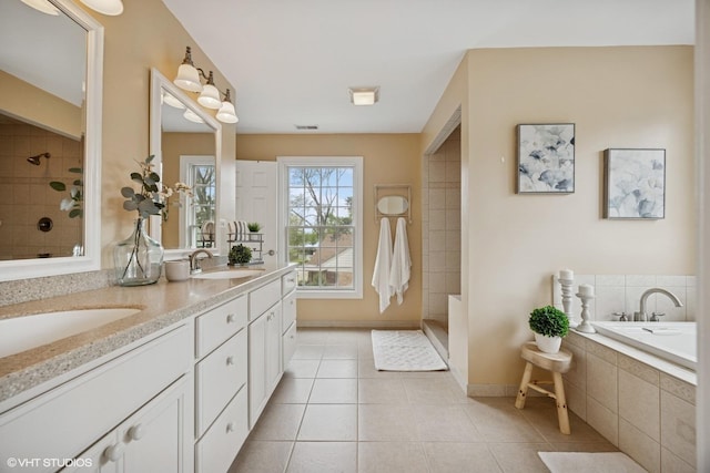 34017 N Prospect Dr, Grayslake, IL 60030 - bathroom featuring tile patterned flooring, double vanity, a bath, tiled shower, and baseboards