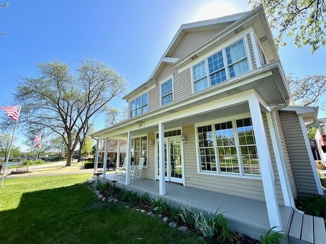 34017 N Prospect Dr, Grayslake, IL 60030 - back of property featuring covered porch and a lawn