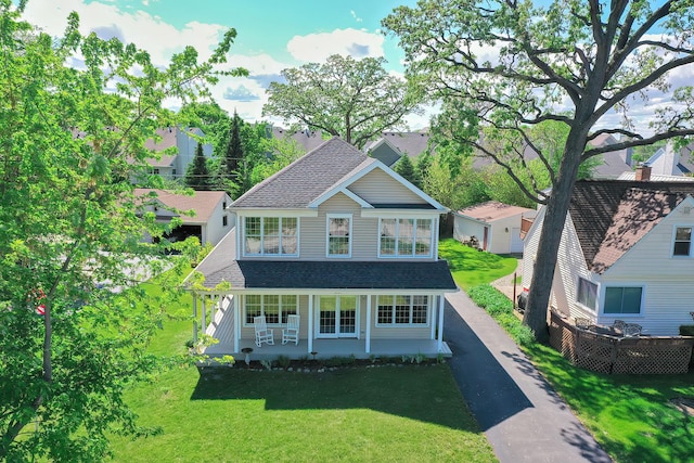 34017 N Prospect Dr, Grayslake, IL 60030 - traditional home with a shingled roof, a front yard, and covered porch