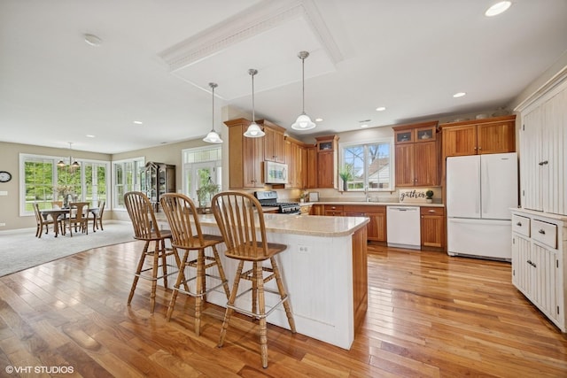 34017 N Prospect Dr, Grayslake, IL 60030 - kitchen with white appliances, a sink, a peninsula, light countertops, and light wood finished floors