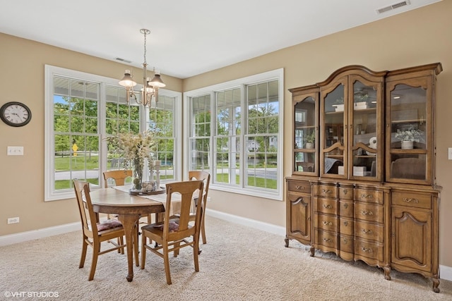34017 N Prospect Dr, Grayslake, IL 60030 - dining area featuring a chandelier, light colored carpet, and baseboards