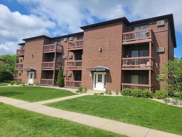 1140 Cedar St Unit 3A, Glendale Heights, IL 60139 - view of apartment building / complex featuring a wall mounted air conditioner