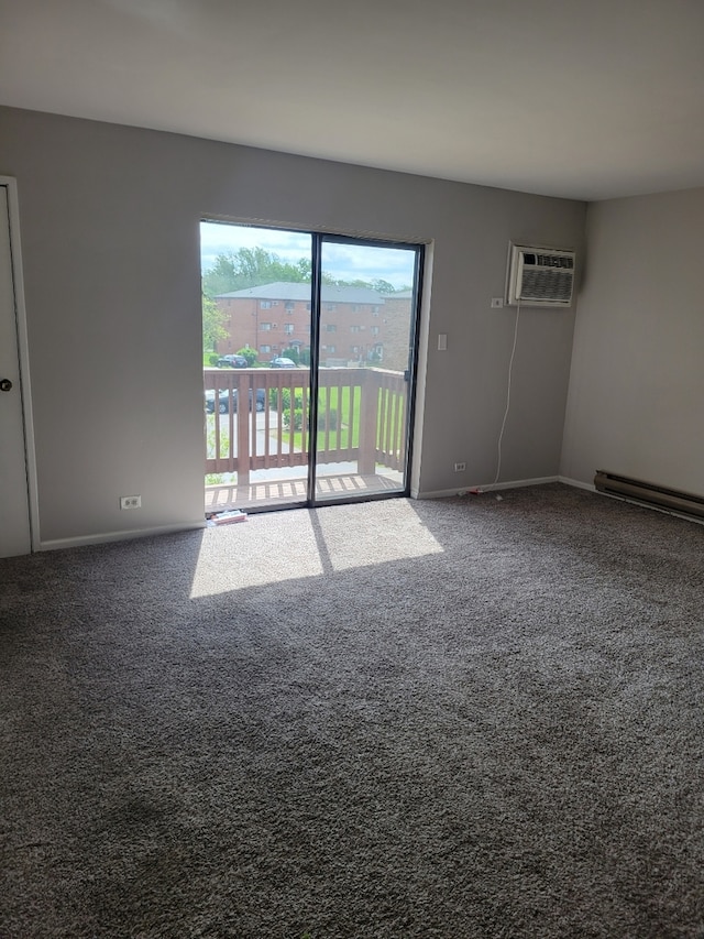 1140 Cedar St Unit 3A, Glendale Heights, IL 60139 - carpeted empty room featuring a wall unit AC and baseboards