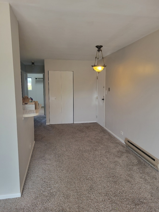 1140 Cedar St Unit 3A, Glendale Heights, IL 60139 - carpeted spare room featuring baseboards and a baseboard heating unit
