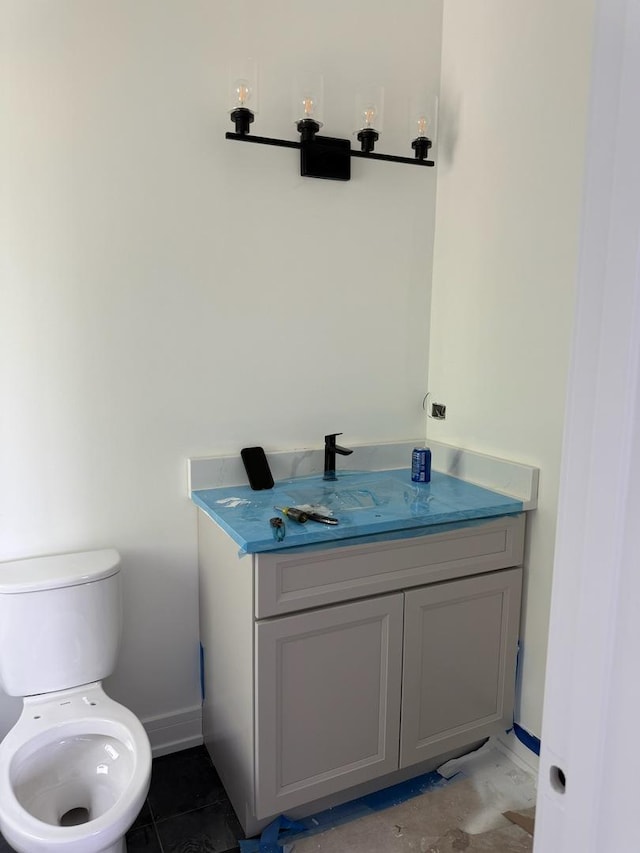 3811 W Pratt Ave, Lincolnwood, IL 60712 - half bath featuring vanity, toilet, and baseboards