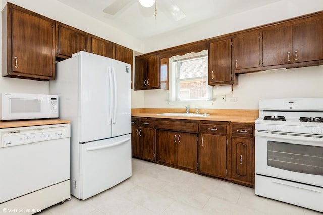 2852 W 84th Pl, Chicago, IL 60652 - kitchen featuring white appliances, a sink, light countertops, and dark brown cabinets