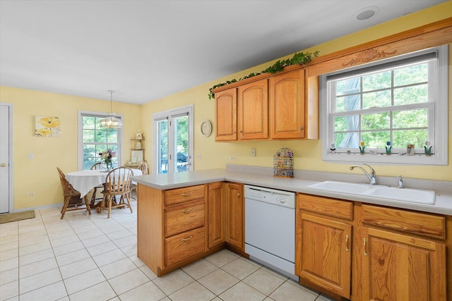 2697 Creekside Ln, Morris, IL 60450 - kitchen featuring dishwasher, a sink, a peninsula, and plenty of natural light