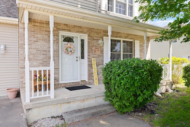 2697 Creekside Ln, Morris, IL 60450 - property entrance featuring a porch and brick siding