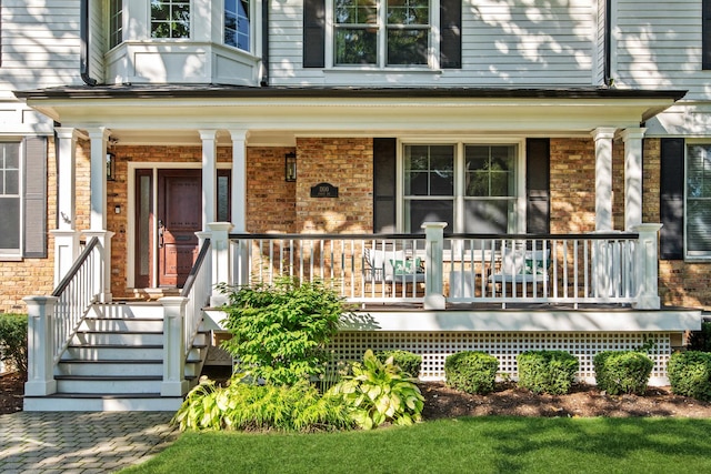1100 Forest Ave, Wilmette, IL 60091 - property entrance featuring a porch and brick siding