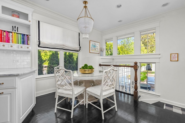 1100 Forest Ave, Wilmette, IL 60091 - dining area with plenty of natural light, baseboards, dark wood-style flooring, and crown molding