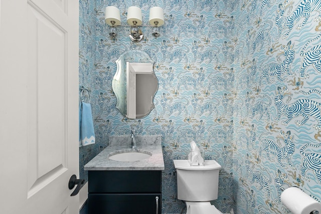 1100 Forest Ave, Wilmette, IL 60091 - bathroom featuring toilet, wallpapered walls, and vanity