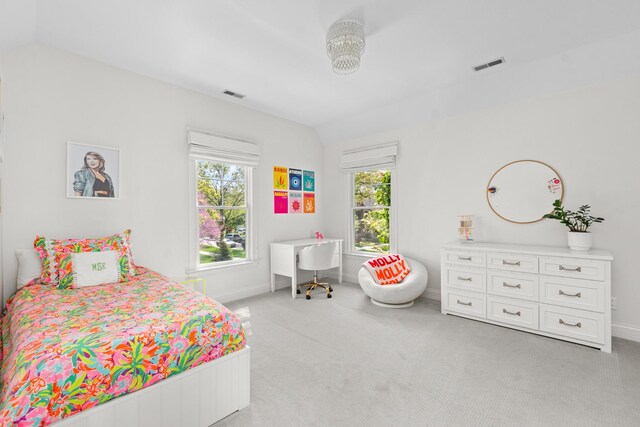 1100 Forest Ave, Wilmette, IL 60091 - bedroom with light carpet, vaulted ceiling, multiple windows, and baseboards
