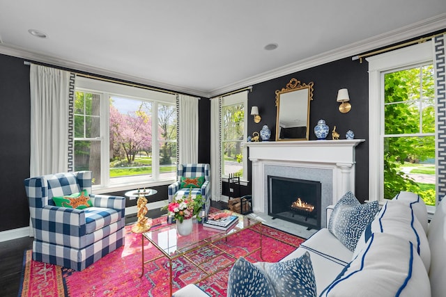 1100 Forest Ave, Wilmette, IL 60091 - living room with crown molding, a fireplace with flush hearth, plenty of natural light, baseboards, and wood finished floors