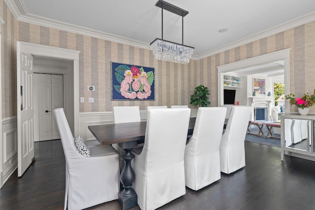 1100 Forest Ave, Wilmette, IL 60091 - dining room featuring wallpapered walls, a chandelier, dark wood finished floors, crown molding, and wainscoting