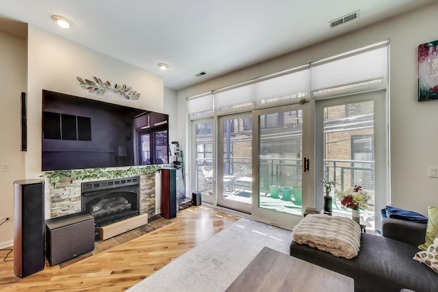 2251 W Saint Paul Ave Unit 2D, Chicago, IL 60647 - living area with wood finished floors, a fireplace, and recessed lighting