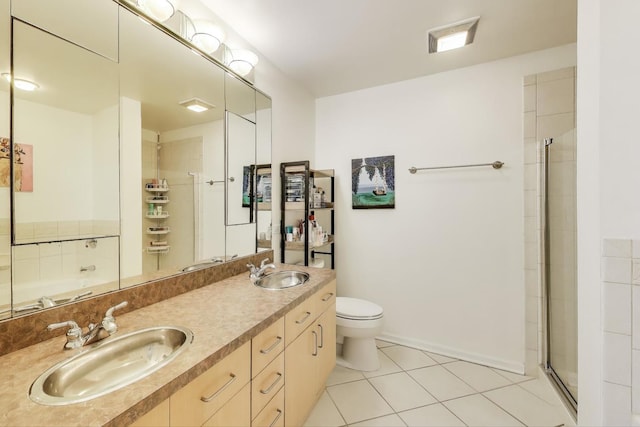 2251 W Saint Paul Ave Unit 2D, Chicago, IL 60647 - bathroom featuring tile patterned floors, tiled shower, toilet, and double vanity