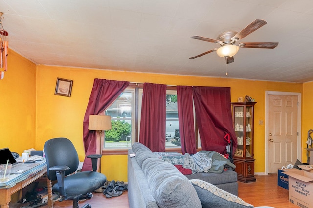 403 W School St, Plano, IL 60545 - living area featuring wood finished floors and ceiling fan