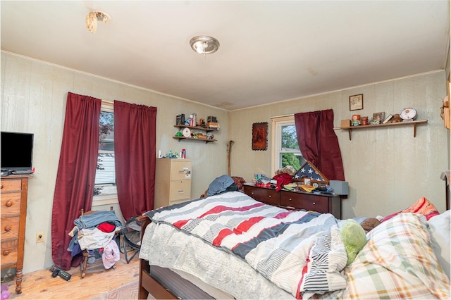 403 W School St, Plano, IL 60545 - bedroom with light wood-style floors and crown molding