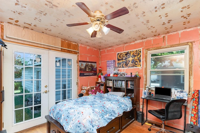 403 W School St, Plano, IL 60545 - bedroom featuring light wood-style floors, multiple windows, access to outside, and a desk