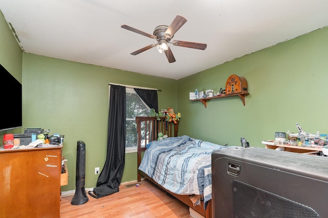 403 W School St, Plano, IL 60545 - bedroom featuring light wood finished floors, a ceiling fan, and baseboards