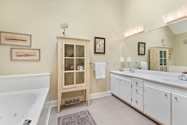 1040 Shermer Rd, Northbrook, IL 60062 - full bathroom featuring a jetted tub, double vanity, tile patterned floors, and baseboards