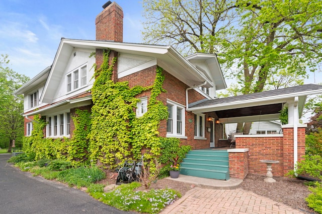 1040 Shermer Rd, Northbrook, IL 60062 - view of side of property with a chimney and brick siding