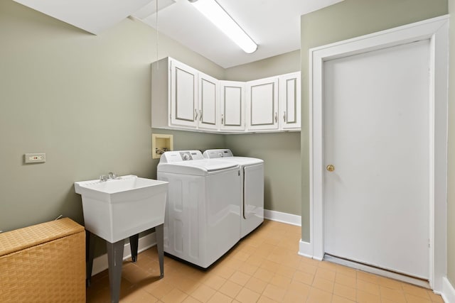 1040 Shermer Rd, Northbrook, IL 60062 - washroom featuring cabinet space, washing machine and dryer, light tile patterned flooring, and baseboards